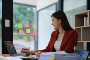 planning, auditing, business planning, finance, young asian business woman working on computer and checking investment documents and planning marketing to increase profit, business concepts.