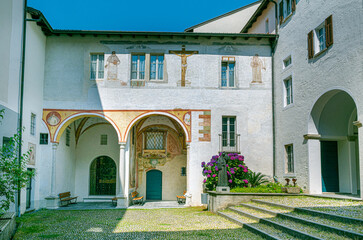 Fototapeta na wymiar Cloister courtyard of capuchin monastery, pilgrimage church Madonna del Sasso. Orselina, Locarno, Ticino, Switzerland. Europe