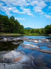 Catskill Creek landscape with transparent water and abstract geometric shapes of the rocks in Hudson Valley, upstate New York