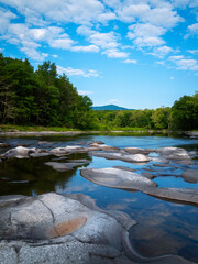 Catskill Creek landscape with transparent water and abstract geometric shapes of the rocks in...