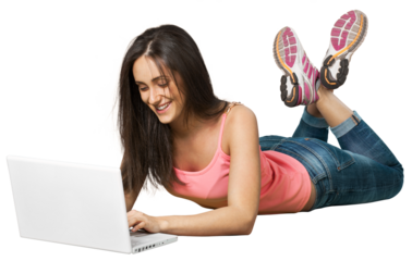 Young woman lying down in front of a laptop