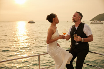 couple drinking orange juice in luxury yacht