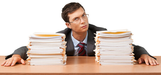 Portrait of a Serious Employee Behind a Stack of Folders