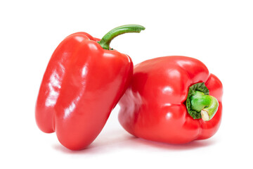 Two Fresh Red Sweet Bell Peppers Isolated on White Background