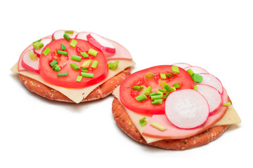 Crispy Cracker Sandwiches with Tomato, Sausage, Cheese, Green Onions and Radish - Isolated on White. Easy Breakfast. Diet Food. Quick and Healthy Sandwiches. Crispbread with Tasty Filling - Isolation