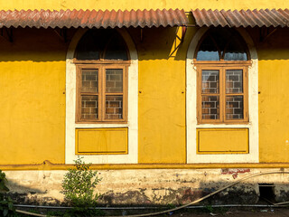 Fototapeta na wymiar Vintage windows of an old house in the town of Margao in Goa.