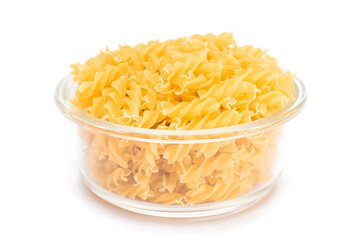 Uncooked Fusilli Pasta in Glass Jar Isolated on White Background. Fat and Unhealthy Food. Classic Dry Spiral Macaroni. Italian Culture and Cuisine. Raw Pasta