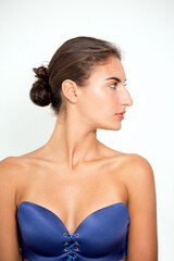 Sensual young woman wearing blue tube bra.