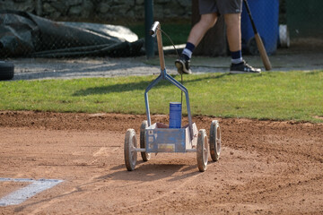 Field marking machine at a baseball game