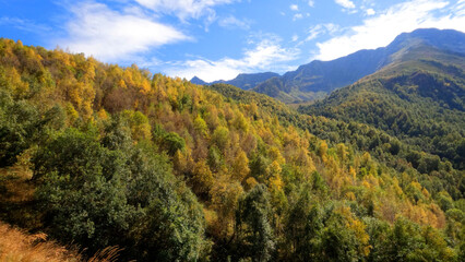 mountain landscape, view of Arkhyz mountain ridge at autumn with blue sky - photo of nature