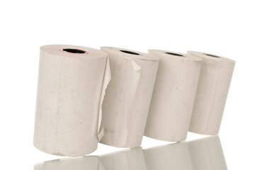 Four rolls of paper cash register tape, close-up isolated on white background.