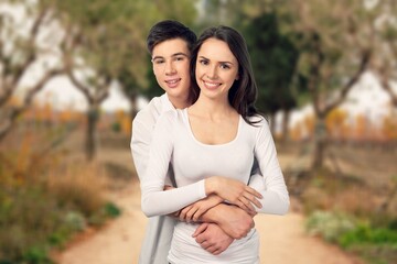 Love, happy young couple on outdoor background