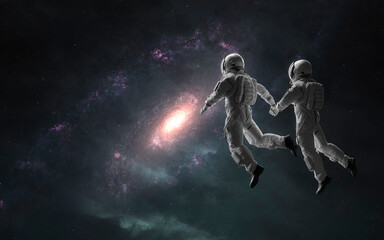 Astronauts couple in deep space. 5K realistic science fiction art. Elements of image provided by Nasa