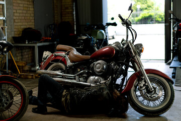 Fototapeta na wymiar authentic motorcycle workshop a beautiful modern motorcycle stands in the garage before repair