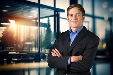 Portrait of the successful young male businessman in office building