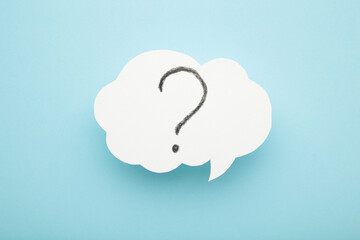 Question mark speech bubble on blue background.