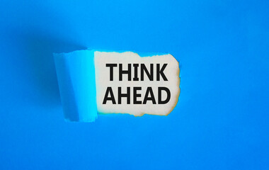 Think ahead symbol. Concept words Think ahead on beautiful white paper on a beautiful blue background. Business, support, motivation, psychological and think ahead concept. Copy space.