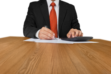 Close-up of a Businessman Working with Calculator
