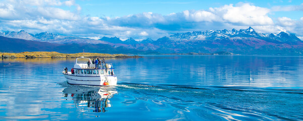 Tour ship sailing at beagle channel, ushuaia, argentina - obrazy, fototapety, plakaty