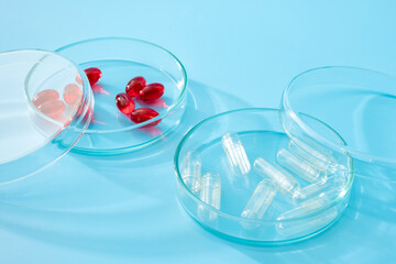 Red Pills and Empty Placebo Capsules in Glass Petri Dish Concept for Placebo Controlled Clinical Research, Latest Medical Research Studies and Sample Testing in Pharmaceutics