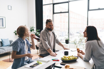 Positive family spending time together in kitchen