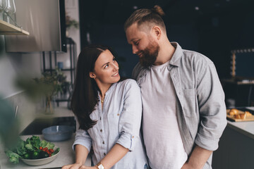 Loving couple having romantic date in kitchen
