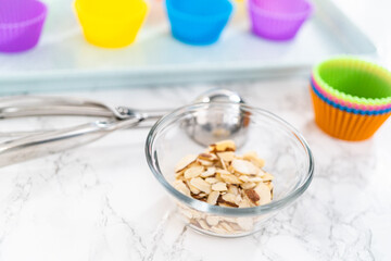 Lemon poppy seed muffins garnished with almond slivers