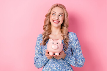 Photo of cute nice young woman wear blue stylish blouse hold piggy bank wallet earnings look mockup...