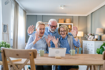 senior mature family or friends use digital tablet online video call