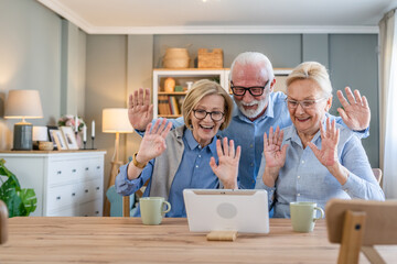 senior mature family or friends use digital tablet online video call