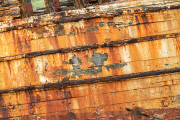 part of the bow of shipwreck with rust and peeled paint in the ship graveyard of Camaret-sur-Mer, Finisterre, Brittany, France