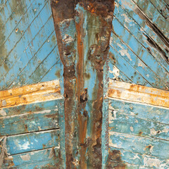 Bow of shipwreck with rust and peeled paint in the ship graveyard of Camaret-sur-Mer, Finisterre, Brittany, France