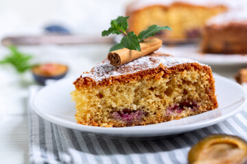 Slices of sponge cake with plums.