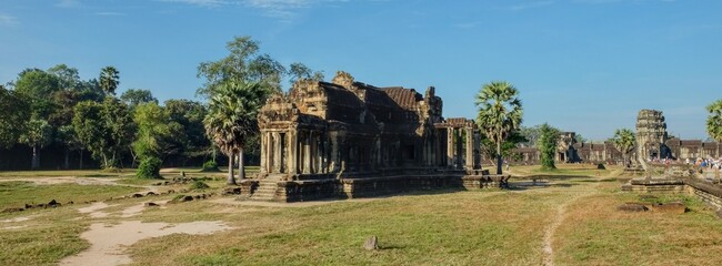 Fototapeta na wymiar An abandoned dilapidated stone building from the Khmer Empire in Southeast Asia on a sunny day, ancient Cambodian architecture.