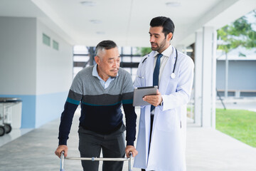 Yong male doctor consulting senior man at hospital. Medical staff explaining diagnosis to patient. Medicine and healthcare concept.