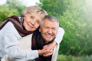 Active senior old couple at park.