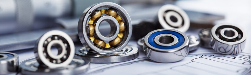 bearings of different types, micrometer, caliper and ruler on the drawings of technical products. Technologies and engineering.