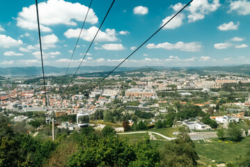 Guimaraes, Portugal. April 14, 2022: Panoramic of Guimaraes and cable car of the city with...