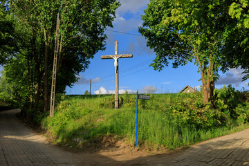Fototapeta na wymiar Summer on Kashubia: catholic cross installed on the crossroad near Zawory, Poland