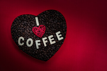 I love coffee background coffee beans in a heart shape box isolated on red colour background with copy space, International Coffee day image