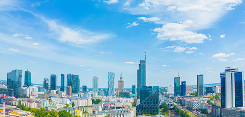 Aerial panorama of Warsaw, Poland over the Vistual river and City center in a distance. Downtown skyscrapers cityscape. Business