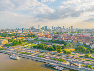 Aerial panorama of Warsaw, Poland over the Vistual river and City center in a distance Old town....