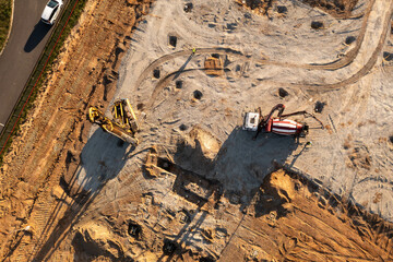 Drone footage of constructions site, machinery and people working