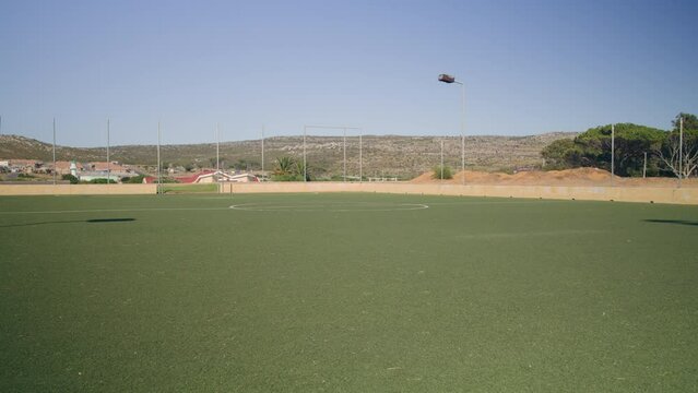 a green sport field outside in neighbourhood