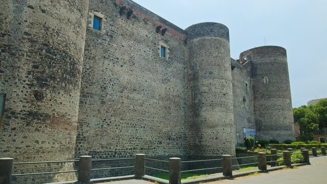 Panoramic view of the Ursino castle in Catania, Sicily. European castle with the royal archaeological collection, objects from the monastery, and painted carts in Italy.