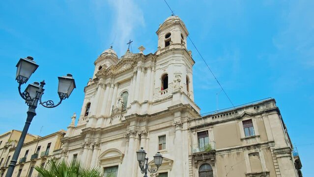 Beautiful Cathedral in the old town of Catania, Sicily. Prominent baroque cathedral with columned facade, domed roof, frescoes, and stunning paintings in Italy.