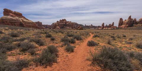 hiking the chesler park loop trail in the needles in canyonlands national park, usa