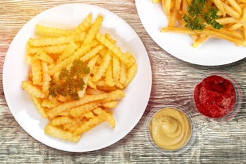 French fries chips with ketchup on desk