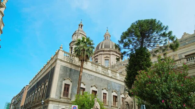 Beautiful view of the Basilica Cattedrale di Sant'Agata in Catania, Italy. Prominent baroque cathedral with columned facade, domed roof, frescoes, and stunning paintings in Italy.