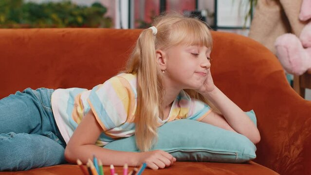 Sad lonely toddler girl at home looks pensive thinks over life concerns or study test exam fail, suffers from unfair situation. Teen child, kid problem, break up, depressed feeling bad annoyed burnout